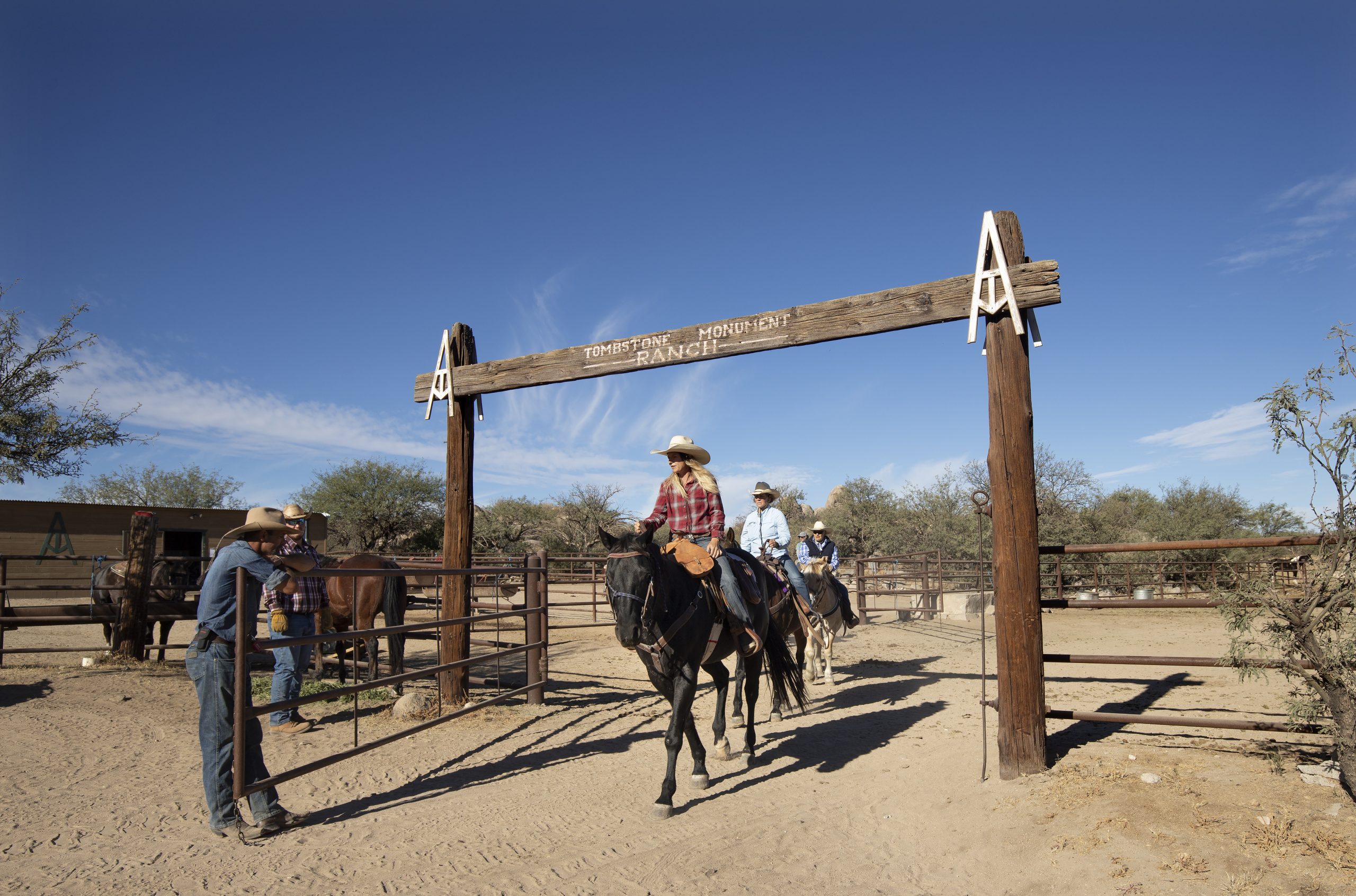 Riders on horseback at Tombstone Monument Ranch, a True Guest Ranch.